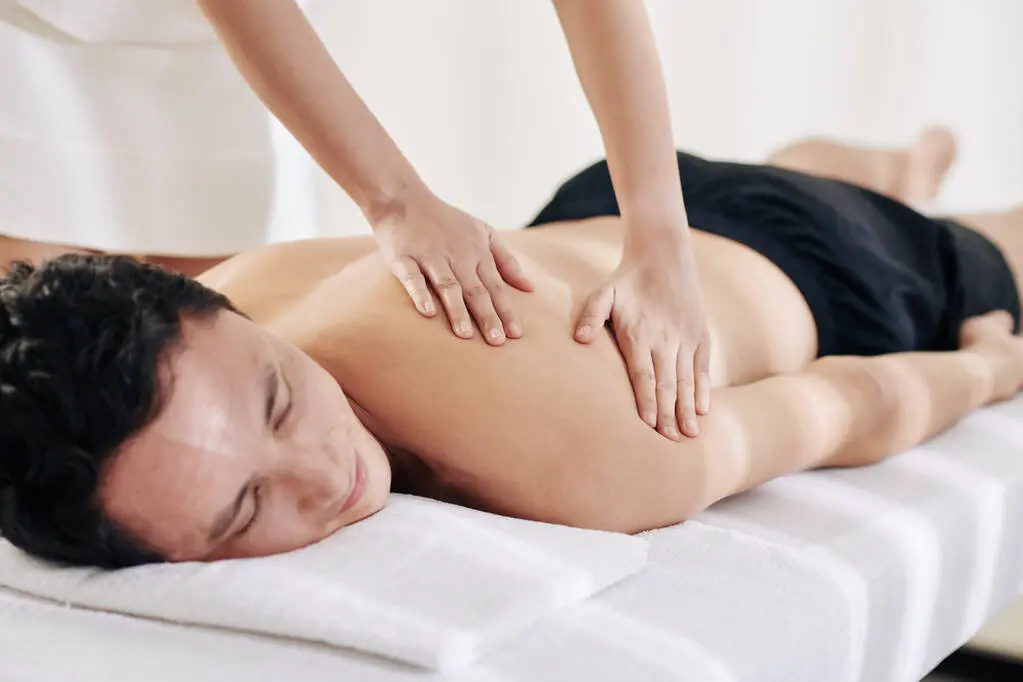stock-photo-masseuse-making-gliding-movements-long-even-strokes-spreading-warmed-oil